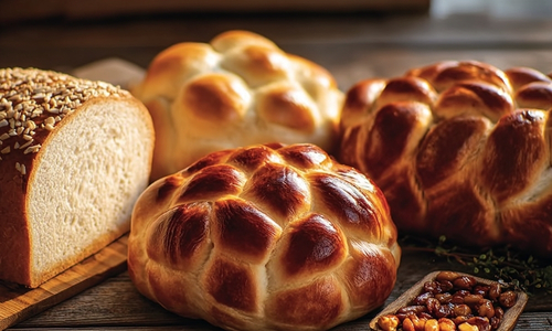 Freshly baked breads on a wooden board
